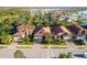 Aerial view of well-maintained homes featuring manicured lawns and lush landscaping at 108 Maraviya Blvd, Nokomis, FL 34275