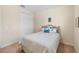 Cozy bedroom with a striped bedspread, complemented by beach themed throw pillows and decor at 108 Maraviya Blvd, Nokomis, FL 34275