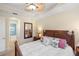 Bedroom featuring decorative pillows and bedside table with a lamp at 108 Maraviya Blvd, Nokomis, FL 34275