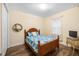 Cozy bedroom with wood floors, complemented by a comfortable bed and closet at 108 Maraviya Blvd, Nokomis, FL 34275