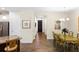 Dining room with hardwood floors and an open concept view to the front door at 108 Maraviya Blvd, Nokomis, FL 34275