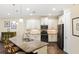 Modern kitchen featuring stainless appliances, granite countertops, and a kitchen island with bar stool seating at 108 Maraviya Blvd, Nokomis, FL 34275