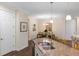 Open kitchen with granite counters and stainless sink is adjacent to the dining area at 108 Maraviya Blvd, Nokomis, FL 34275