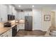 Kitchen boasts granite counters, stainless appliances, and tiled backsplash at 108 Maraviya Blvd, Nokomis, FL 34275