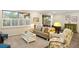 Bright and airy living room with plantation shutters, comfortable seating, and neutral decor at 108 Maraviya Blvd, Nokomis, FL 34275