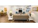Open-concept living room featuring hardwood floors and a view to the dining area at 108 Maraviya Blvd, Nokomis, FL 34275