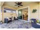 Inviting covered patio with comfortable seating and views of the beautifully landscaped backyard at 108 Maraviya Blvd, Nokomis, FL 34275
