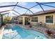 Enjoy outdoor living with this screened-in pool, spa, and patio area perfect for entertaining at 108 Maraviya Blvd, Nokomis, FL 34275
