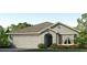 Charming single-story home featuring a two-car garage and beautifully landscaped front yard, perfect for suburban living at 10853 Gentle Current Way, Parrish, FL 34219
