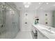 Bright bathroom offers a modern design, dual sinks, and glass-enclosed shower, perfect for daily routines at 1155 N Gulfstream Ave # 708, Sarasota, FL 34236