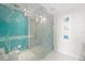 Contemporary bathroom featuring a glass shower adorned with stylish aquatic patterns and modern fixtures at 1155 N Gulfstream Ave # 708, Sarasota, FL 34236