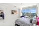 Bright bedroom with city views, featuring modern furniture and stylish zebra-print bedding accents at 1155 N Gulfstream Ave # 708, Sarasota, FL 34236