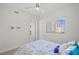 Bright bedroom with a splatter-paint comforter and city views from the window at 1155 N Gulfstream Ave # 708, Sarasota, FL 34236