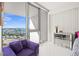 Bedroom boasts natural light, modern furniture, and stunning marina views for relaxed and sophisticated living at 1155 N Gulfstream Ave # 708, Sarasota, FL 34236