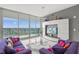 Modern living room with panoramic water views, contemporary furnishings, and a chic entertainment center at 1155 N Gulfstream Ave # 708, Sarasota, FL 34236