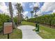 Community bark park with green space, seating, and waste station at 12410 Osorio Ct # 204, Sarasota, FL 34238
