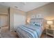 Comfortable bedroom with a large double door closet and ceiling fan at 12410 Osorio Ct # 204, Sarasota, FL 34238