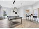 Community game room with a ping pong table, seating and modern lighting at 12410 Osorio Ct # 204, Sarasota, FL 34238