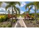 Lawn bowling and seating with vibrant landscaping and manicured grounds at 12410 Osorio Ct # 204, Sarasota, FL 34238