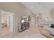 Open living area featuring media center, dining space, and views to other rooms at 12410 Osorio Ct # 204, Sarasota, FL 34238