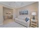 Comfortable living room featuring a plush sofa, modern decor, and an adjacent dining area at 12410 Osorio Ct # 204, Sarasota, FL 34238