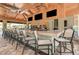 Community pool bar with high ceilings, mounted TVs, and ample seating at 12410 Osorio Ct # 204, Sarasota, FL 34238