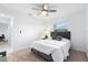 Serene bedroom featuring a comfortable bed, soft carpet, and a view outside the window at 128 Da Vinci Dr, Nokomis, FL 34275