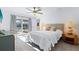 Inviting bedroom with a view of the outdoor pool and patio through sliding glass doors at 128 Da Vinci Dr, Nokomis, FL 34275