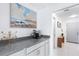 Inviting foyer area with modern countertop, artwork, and stylish decor leading to the living space at 128 Da Vinci Dr, Nokomis, FL 34275