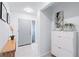 Bright entryway with modern décor, stylish console table, and contemporary artwork on display at 128 Da Vinci Dr, Nokomis, FL 34275
