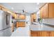 Well-lit kitchen with stainless steel appliances, ample counter space, and updated cabinetry at 128 Da Vinci Dr, Nokomis, FL 34275