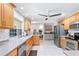 Bright kitchen featuring stainless steel appliances, light wood cabinets, and recessed lighting at 128 Da Vinci Dr, Nokomis, FL 34275