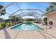 Enjoy the beautiful caged pool with brick paver deck, perfect for enjoying outdoor relaxation and entertaining at 128 Da Vinci Dr, Nokomis, FL 34275