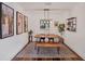 Bright dining room with hardwood floors, modern lighting, and decorative wall art at 1301 6Th W St, Palmetto, FL 34221