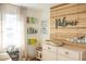 A modern Bedroom is thoughtfully designed with a custom wood accent wall and ample storage for books at 1305 20Th W St, Bradenton, FL 34205