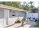 Home exterior with a boat trailer parked alongside a quaint, painted brick building at 1305 20Th W St, Bradenton, FL 34205