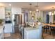 Modern kitchen with stainless steel appliances, a breakfast bar, and stylish pendant lighting fixtures at 1305 20Th W St, Bradenton, FL 34205