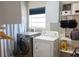 Well-organized laundry room featuring modern washer and dryer set and functional storage solutions at 1305 20Th W St, Bradenton, FL 34205