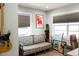 Eclectic living room with unique decor, including a floral couch, guitars, and surfboards, radiating personality at 1305 20Th W St, Bradenton, FL 34205