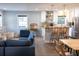 Spacious, open-concept living space with modern kitchen, breakfast bar, and cozy seating area at 1305 20Th W St, Bradenton, FL 34205