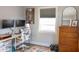 Home office featuring a modern desk setup, natural light, and minimalist decor, creating a professional workspace at 1305 20Th W St, Bradenton, FL 34205