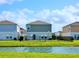 Beautiful view of the back of the home from across the pond at 13068 Oak Hill Way, Parrish, FL 34219