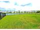 Large backyard with a well-maintained lawn and neighborhood views at 13068 Oak Hill Way, Parrish, FL 34219