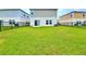 Expansive backyard with lush green grass and a black metal fence at 13068 Oak Hill Way, Parrish, FL 34219