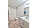 A full bathroom featuring a shower and tub combination with a sleek single sink vanity at 13068 Oak Hill Way, Parrish, FL 34219