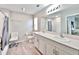 Bathroom featuring double sinks, quartz countertop and bright vanity lighting at 13068 Oak Hill Way, Parrish, FL 34219