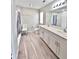 Bathroom featuring double sinks, quartz countertop and bright vanity lighting at 13068 Oak Hill Way, Parrish, FL 34219