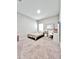 Bright bedroom with neutral carpet, a window, and minimal decorations at 13068 Oak Hill Way, Parrish, FL 34219