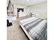 Bright bedroom features a comfortable bed, neutral colors and functional furnishings for a relaxing retreat at 13068 Oak Hill Way, Parrish, FL 34219