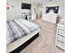 Bedroom featuring a comfortable bed, neutral colors and functional furnishings for a relaxing retreat at 13068 Oak Hill Way, Parrish, FL 34219